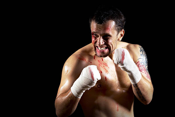 istock boxer with blood on the face 523414143