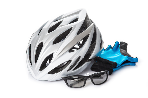 Protection helmet gloves and glasses for cycling isolated on a white background