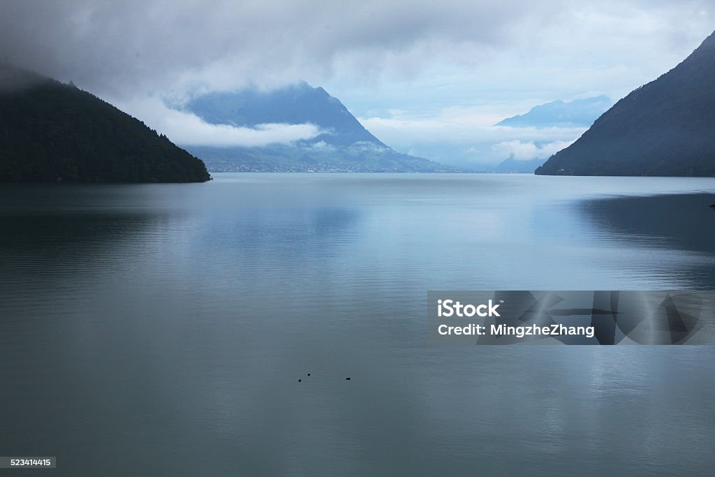 Lake At the other side of lake, there is a small town. Mystery Stock Photo