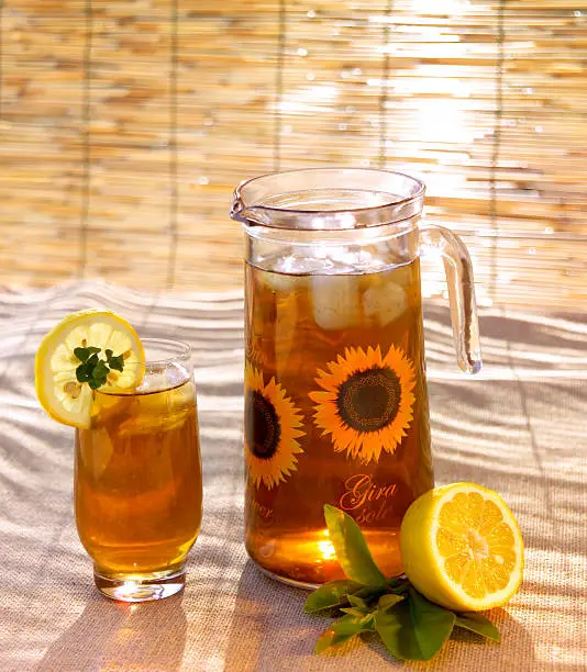 iced tea in a carafe with lemon