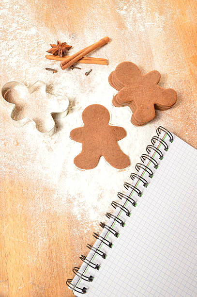 istock Christmas list. The dough for gingerbread. Notebook, gingerbread and flour 523415775