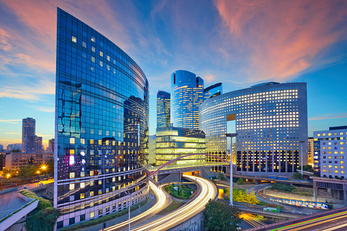 Image of office buildings in modern part of Paris- La Defense during sunset.