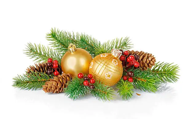 Composition of the Christmas balls, fir branches and cones on a white background