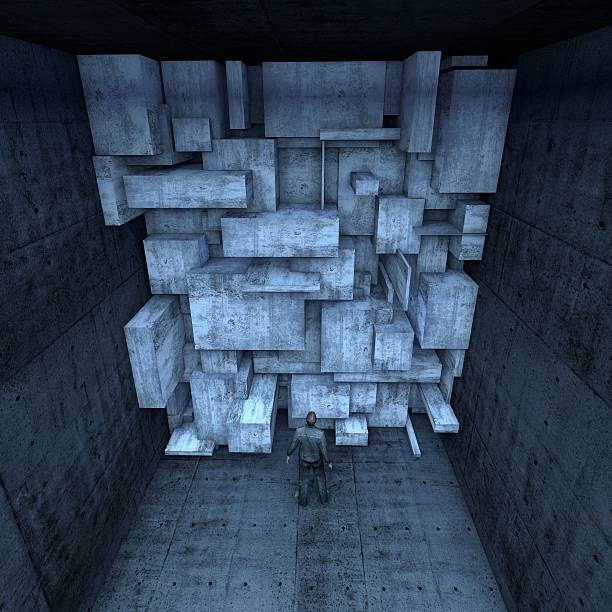istock man in front of rock blocks blocking the entrance 523429475
