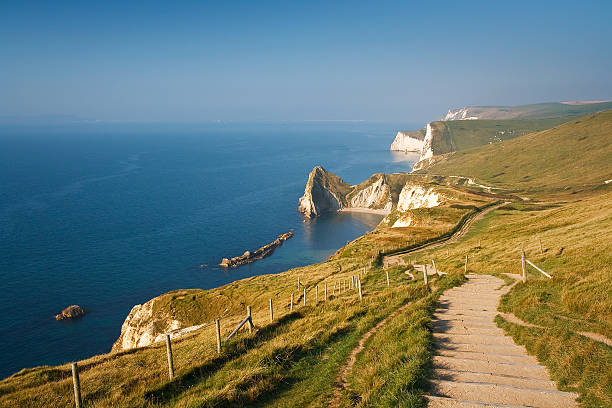 Coast path in Dorset, UK. Coast path along Jurassic Coast in Dorset, UK. jurassic coast world heritage site stock pictures, royalty-free photos & images