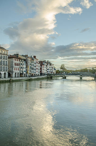 Bayonne at sunset Bayonne, France, and the Nive river at sunset. bayonne stock pictures, royalty-free photos & images