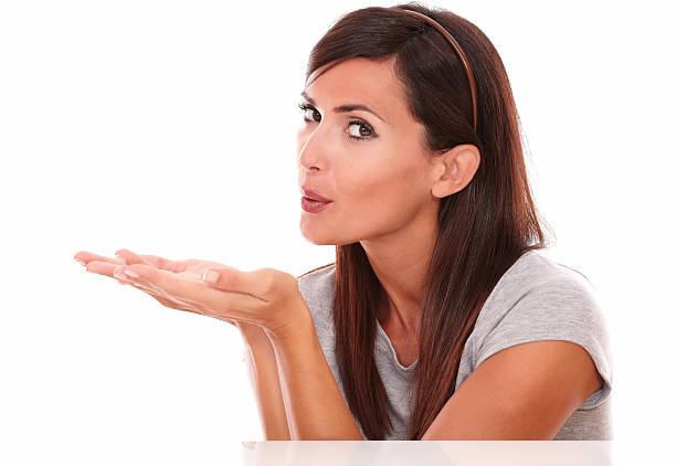 istock Friendly hispanic woman blowing her wish 523440745