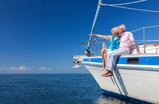 Photo of Happy Senior Couple Sailing on a Sail Boat