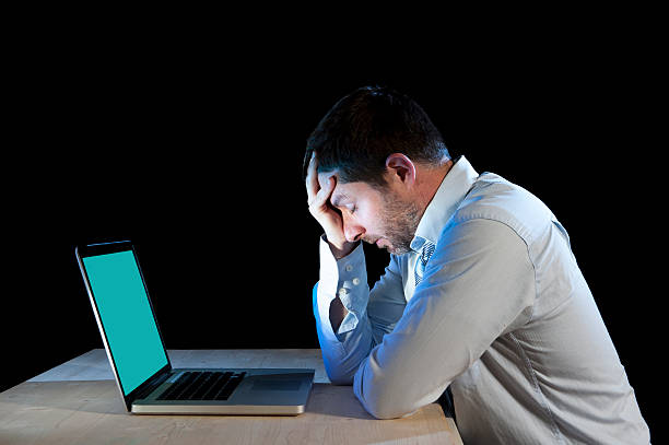 istock businessman working with computer laptop in frustration and depression 523441373