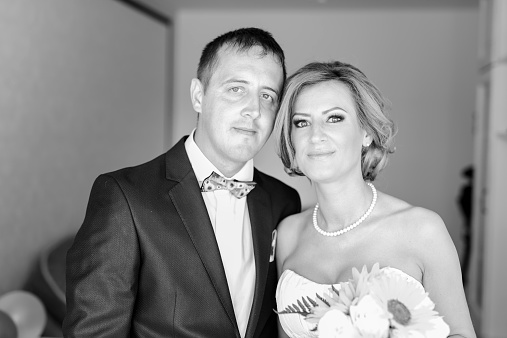 monochrome portrait of bride and groom in their special day.