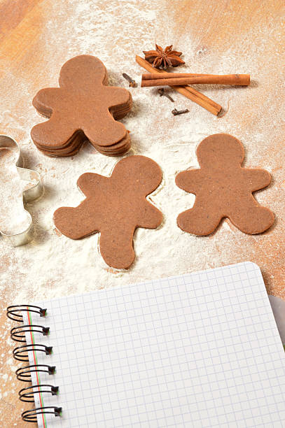 istock Christmas list. The dough for gingerbread. Notebook, gingerbread and flour 523443085