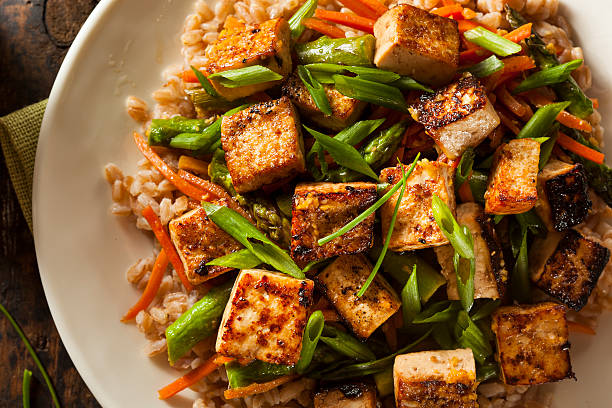 Homemade Tofu Stir Fry Homemade Tofu Stir Fry with Vegetables and Rice crunchy stock pictures, royalty-free photos & images