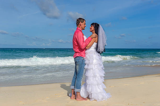 istock Beautiful couple standing on a beach 523445589