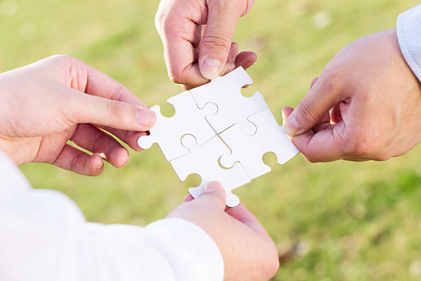 istock puzzle jigsaw and concept with meadow background 523445641