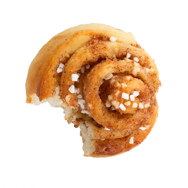 istock close up of an half eaten cinnamon roll 523446551