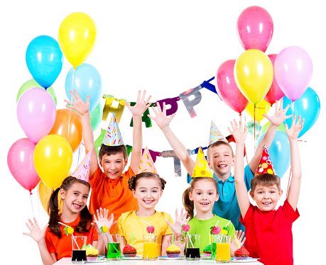 Group of children in colorful shirts at the birthday party with raised hands - isolated on a white.
