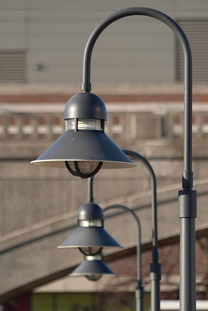 Decorative hooded streetlights in a row stock photo