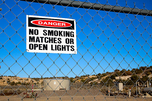 istock Danger sign on Fence for Natural Gas Fracking Site 523458957