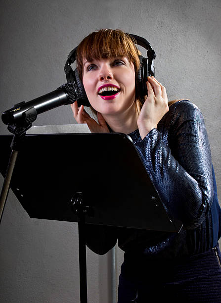 istock Female Singer on Grey Background 523459173