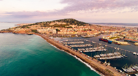 aerial view of the city of sete, france, with mont saint-clair and port. photo taken at sunrise.