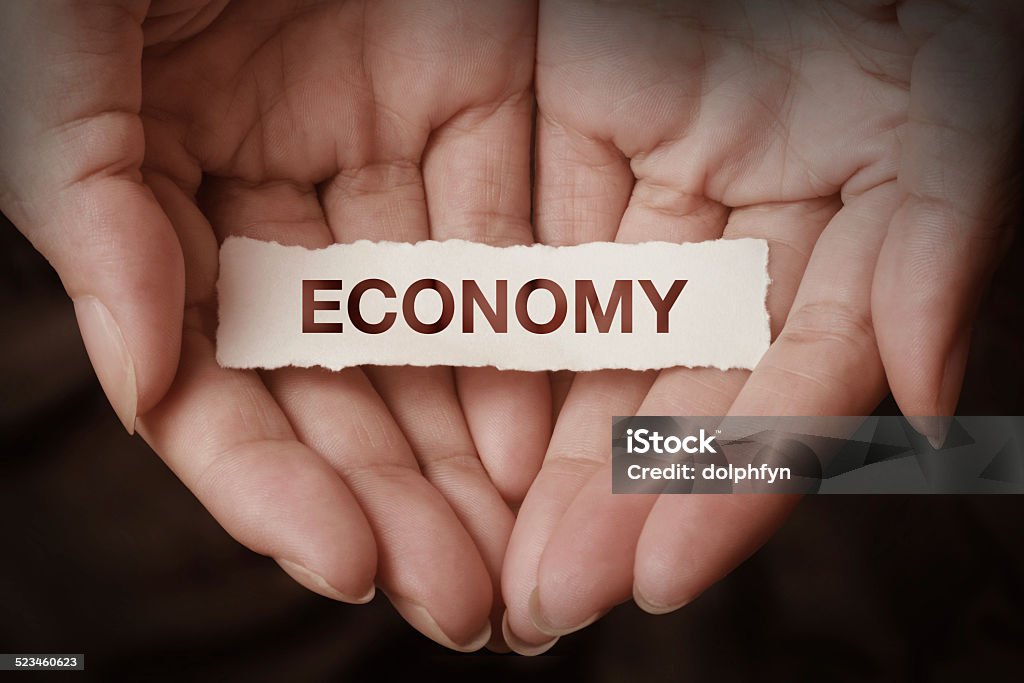 Economy Economy text on hand design concept Concepts Stock Photo
