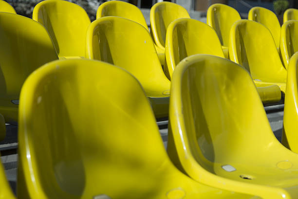 istock Plenty of yellow plastic seats 523469648