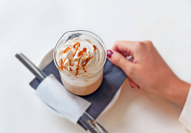 istock Cup of a fresh caramel latte with whipped cream 523470834
