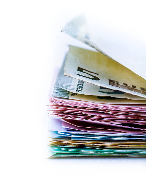 istock Euro banknotes and coins 523471135