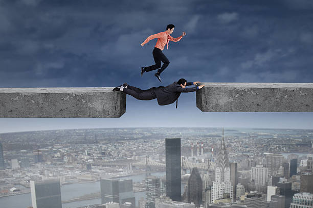istock Businessman runs above his partner 523471233