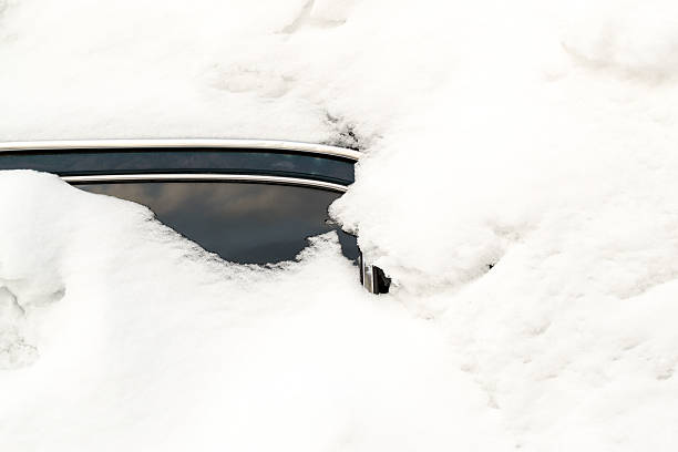 istock Abandoned Snow Covered Car Stuck in Winter Blizzard 523471280