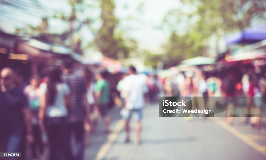 Blurred background : people shopping at market fair Blurred background : people shopping at market fair in sunny day, blur background with bokeh. Traditional Festival Stock Photo