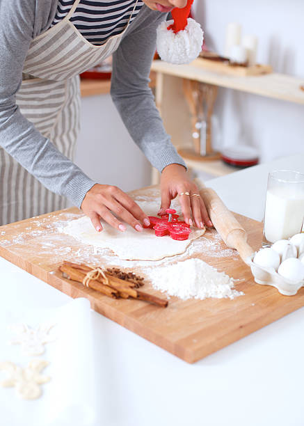 istock Woman making christmas cookies in the kitchen 523471859