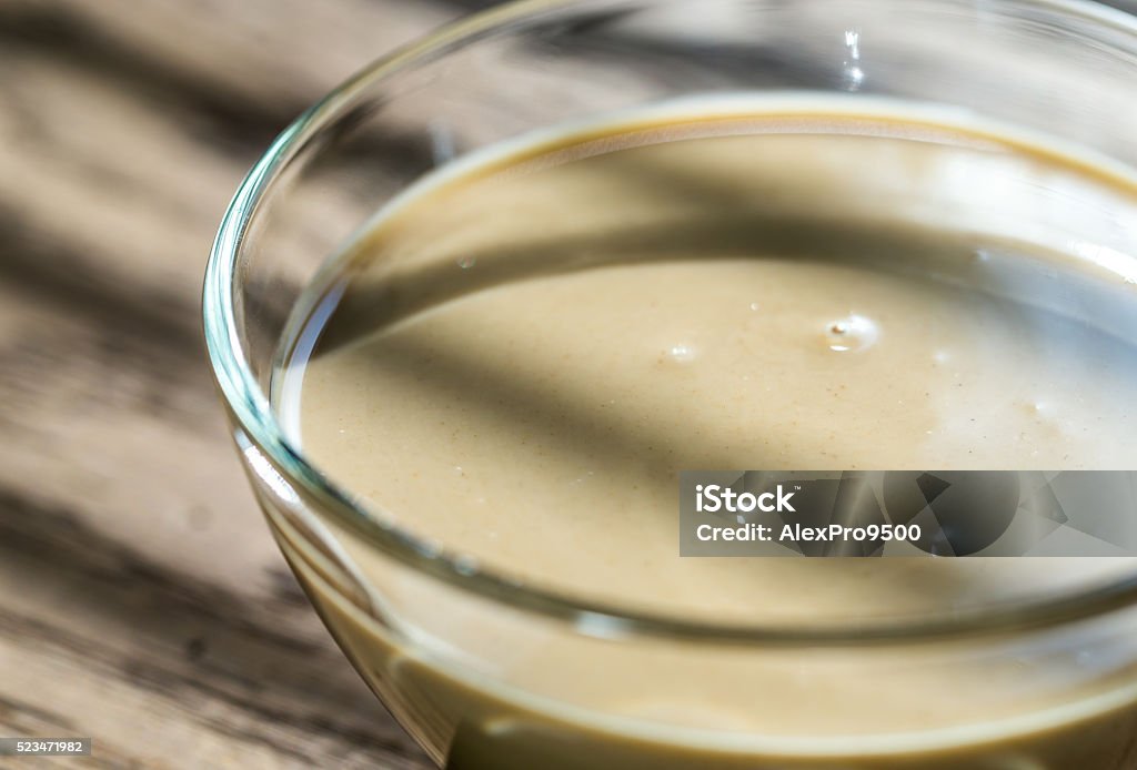 Bowl of tahini Approaching Stock Photo