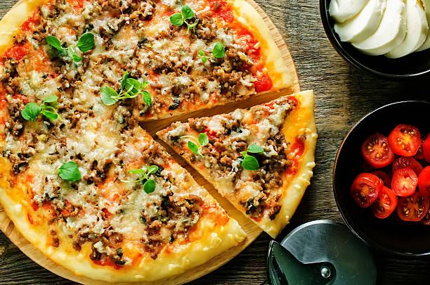 istock pizza with meat, mozzarella and oregano 523472161