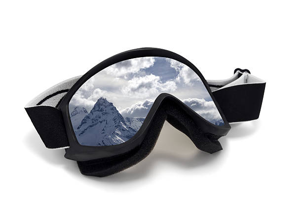 istock Ski goggles with reflection of snow mountains 523472189