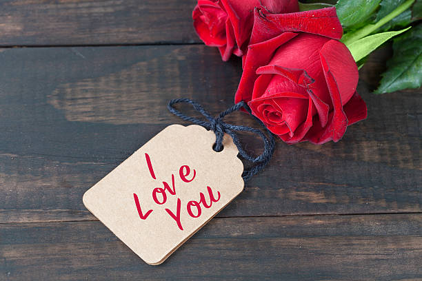 istock I love you text with roses on dark wood 523472480