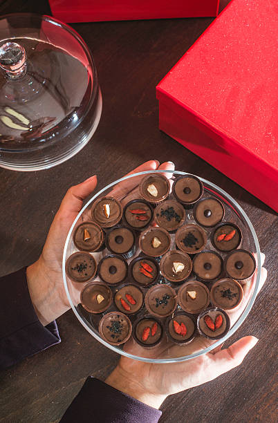 istock Hand holding chocolate bonbons 523472483