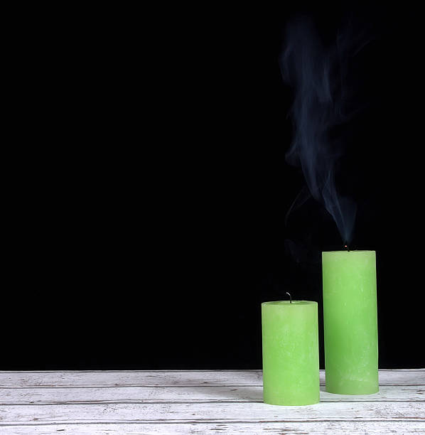istock Smoke and extinct green candles 523473081