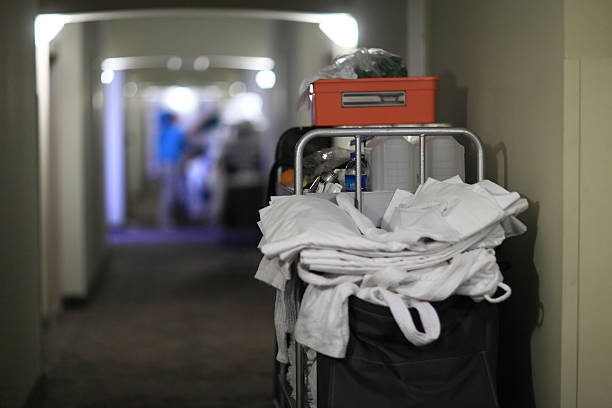 istock Back of cleaning cart with bedclothes 523473121