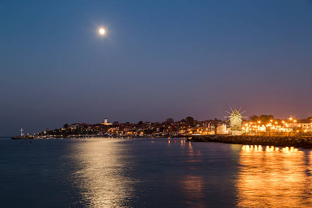 istock Full moon over the coastal city 523473219