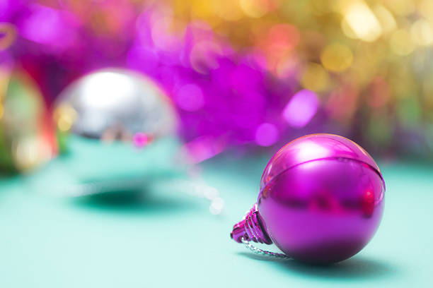 istock purple and  xmas ornaments  holiday background with space for text 523473255