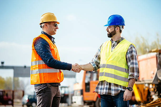 istock Engineer and contractor handshake for successful accomplishment of project phase 523473518