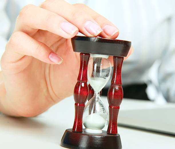 istock Young business woman with hourglass - time concept. 523473521