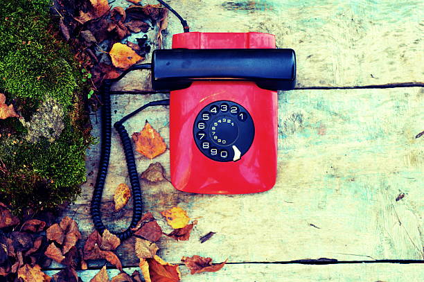 istock Retro rotary telephone on a wooden background 523473683