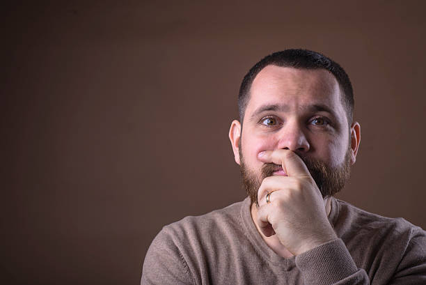 istock Man grimaces photographed in studio 523474332