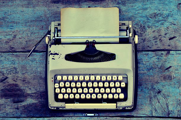 istock Retro typewriter on a wooden background 523474411