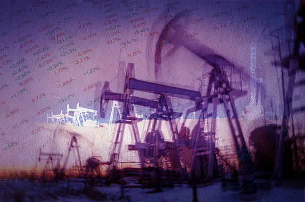 Oil and gas industry background. Work of oil pump jack on a oil field and finance analytics background. Textured concrete grunge, blurred motion. Numbers, figures. Concept oil and gas crisis. oil well stock pictures, royalty-free photos & images
