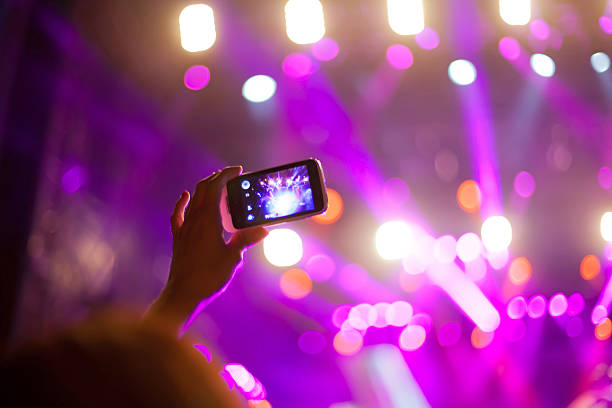 istock Filming with smart phone at concert 523475153