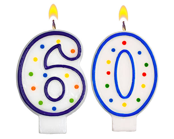 istock Birthday candles number sixty isolated on white background 523475755