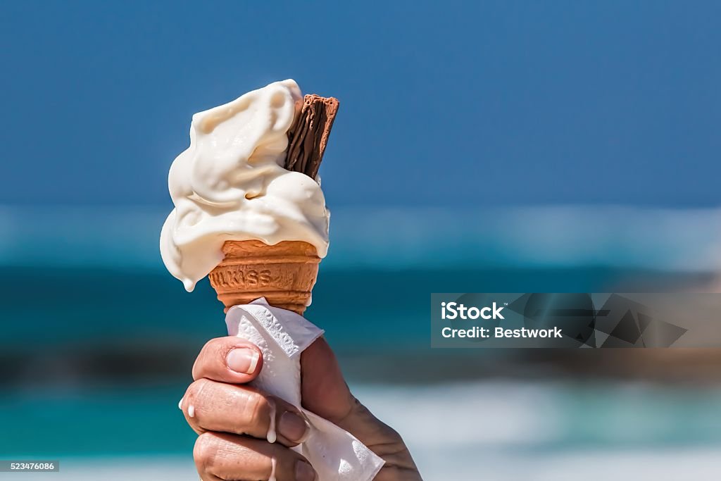 ice cream woman holding ice cream who begin melting. Ice Cream Stock Photo